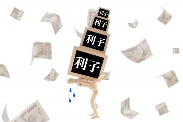 お金を手に頭を抱える。文京区で債務整理の無料相談が司法書士に可能